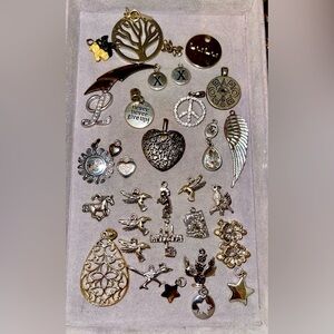Bundle of 34 Silver Tone Charms.